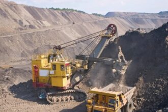 Indian mining and construction equipment including bulldozers, excavators, and dump trucks used for infrastructure and material handling.