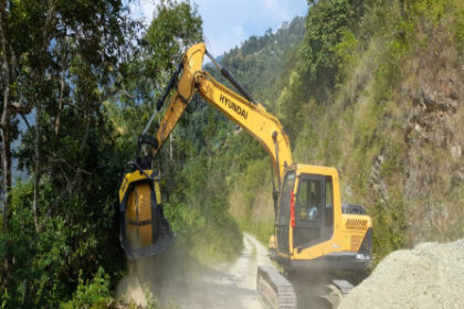 Civil contractor in Sikkim using MB Crusher jaw and screening buckets for road construction in remote Himalayan terrain