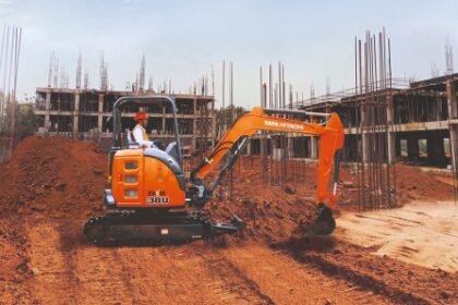 Tata Hitachi ZAXIS 38U mini excavator operating at a construction site, showcasing its compact design, zero-tail swing, and enhanced digging reach.