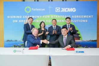 XCMG and Fortescue executives signing green mining equipment deal in Beijing