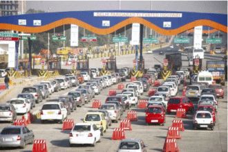 IRB Infrastructure toll plaza with vehicles showing increased traffic flow, symbolizing 9% growth in toll revenue for October 2025.