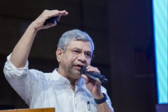 Union Railway Minister Ashwini Vaishnaw speaking at a technology event promoting innovation and digital transformation in Indian Railways through the Rail-Tech Portal.