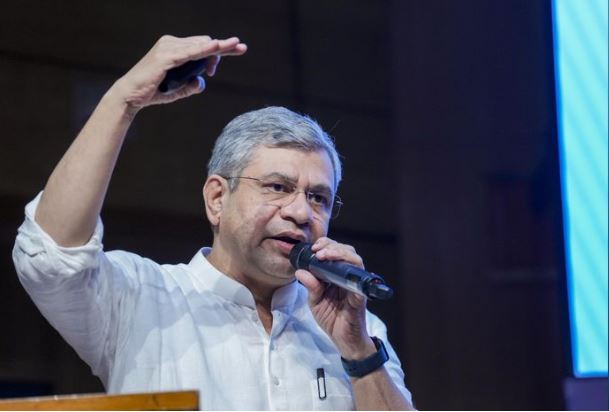 Union Railway Minister Ashwini Vaishnaw speaking at a technology event promoting innovation and digital transformation in Indian Railways through the Rail-Tech Portal.