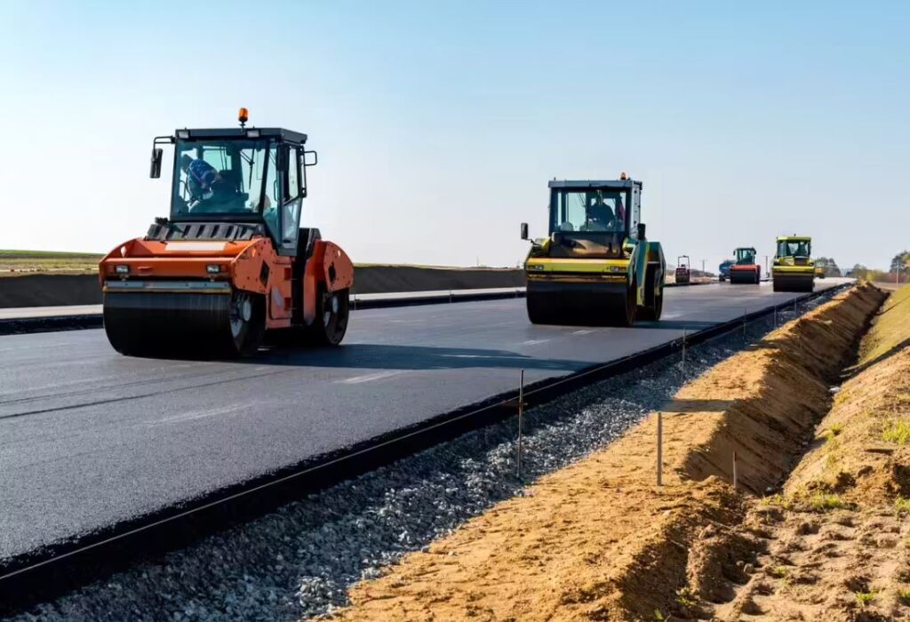 National highway construction site in India showing ongoing roadwork and heavy machinery, reflecting MoRTH’s projected execution of 9,000–9,500 km in FY2026-27 amid slower project awards.