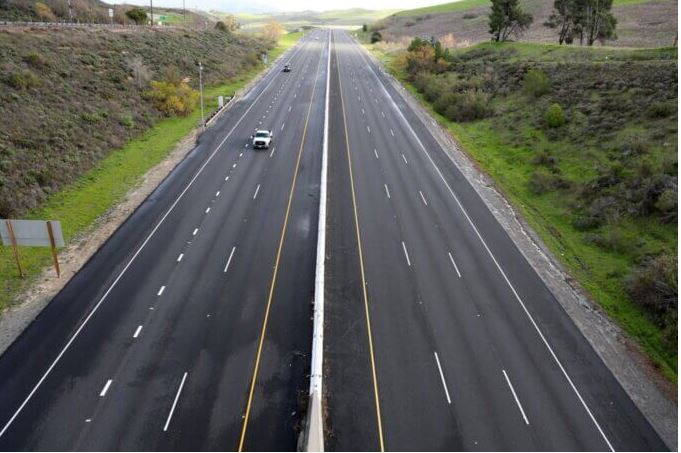 NH 48 Kamrej Chalthan highway expansion project near Surat to six lanes with service roads to reduce congestion