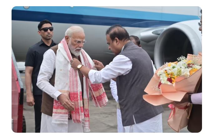 Prime Minister Narendra Modi launching ₹47,000 crore infrastructure projects in Assam including roads, railways, and energy initiatives to boost connectivity in Northeast India.