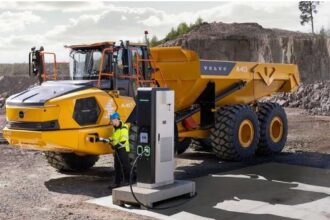 Electric articulated hauler operating at construction or mining site