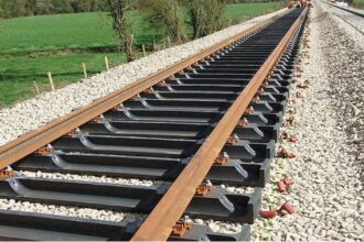 Indian Railways to adopt composite sleepers and AI-based track monitoring, enhancing safety, efficiency, and modern rail infrastructure across India.